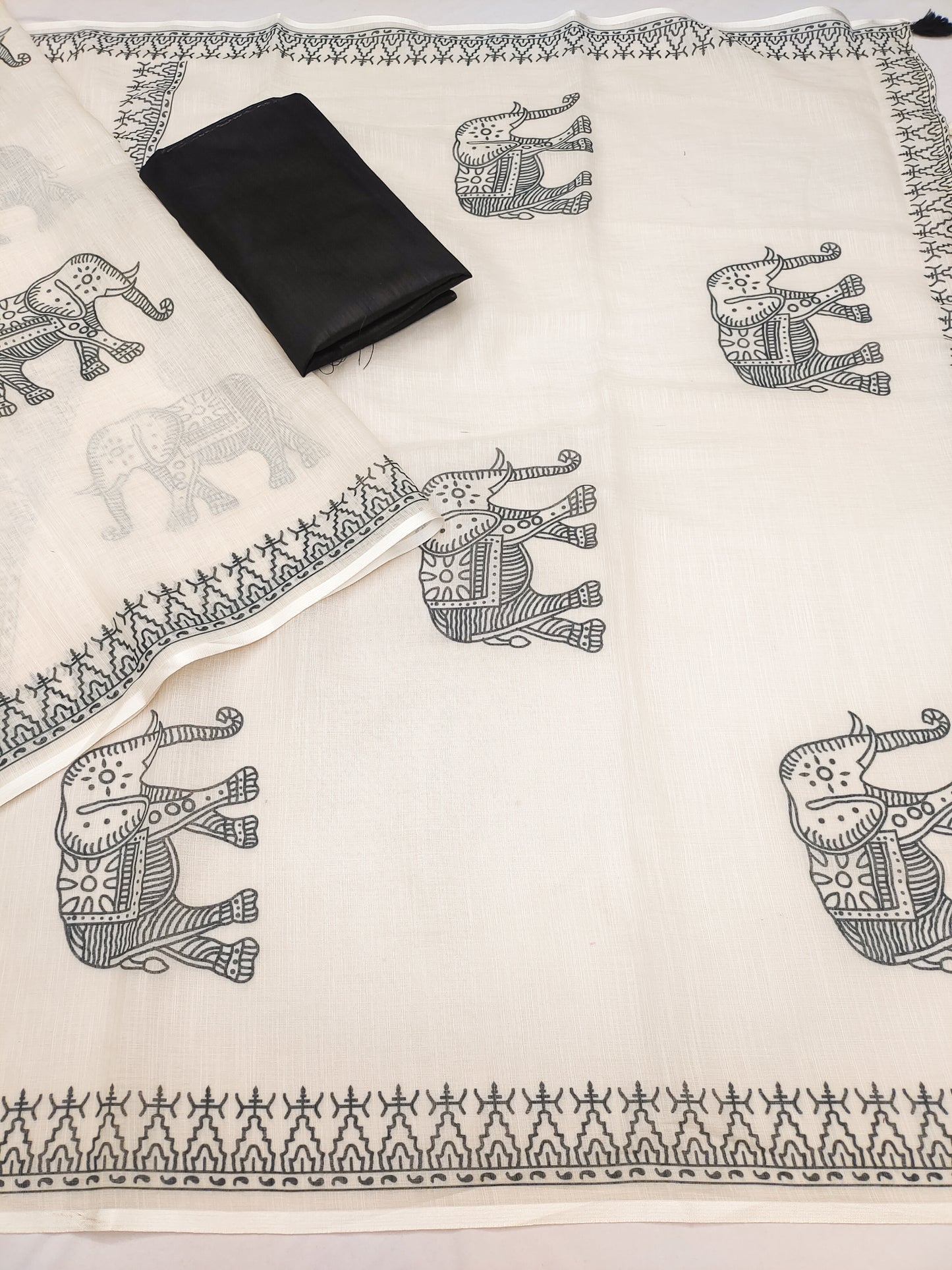 Minimal Off-White Linen Saree with Traditional Elephant Motif & Tribal Border