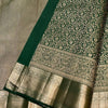 Eloquence Dark Green Soft Banarasi Silk Saree With Engrossing Blouse Piece