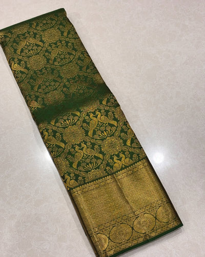 Divine Dark Green Soft Banarasi Silk Saree With Entrancing Blouse Piece