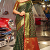 Beauteous Dark Green Patola Silk Saree with Pleasant Blouse Piece