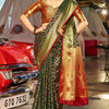 Beauteous Dark Green Patola Silk Saree with Pleasant Blouse Piece