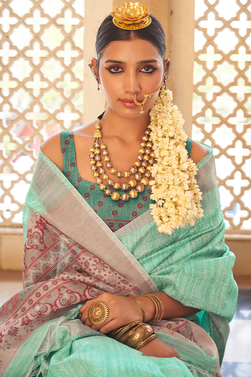 Embrocation Turquoise Cotton Silk Saree With Blooming Blouse Piece
