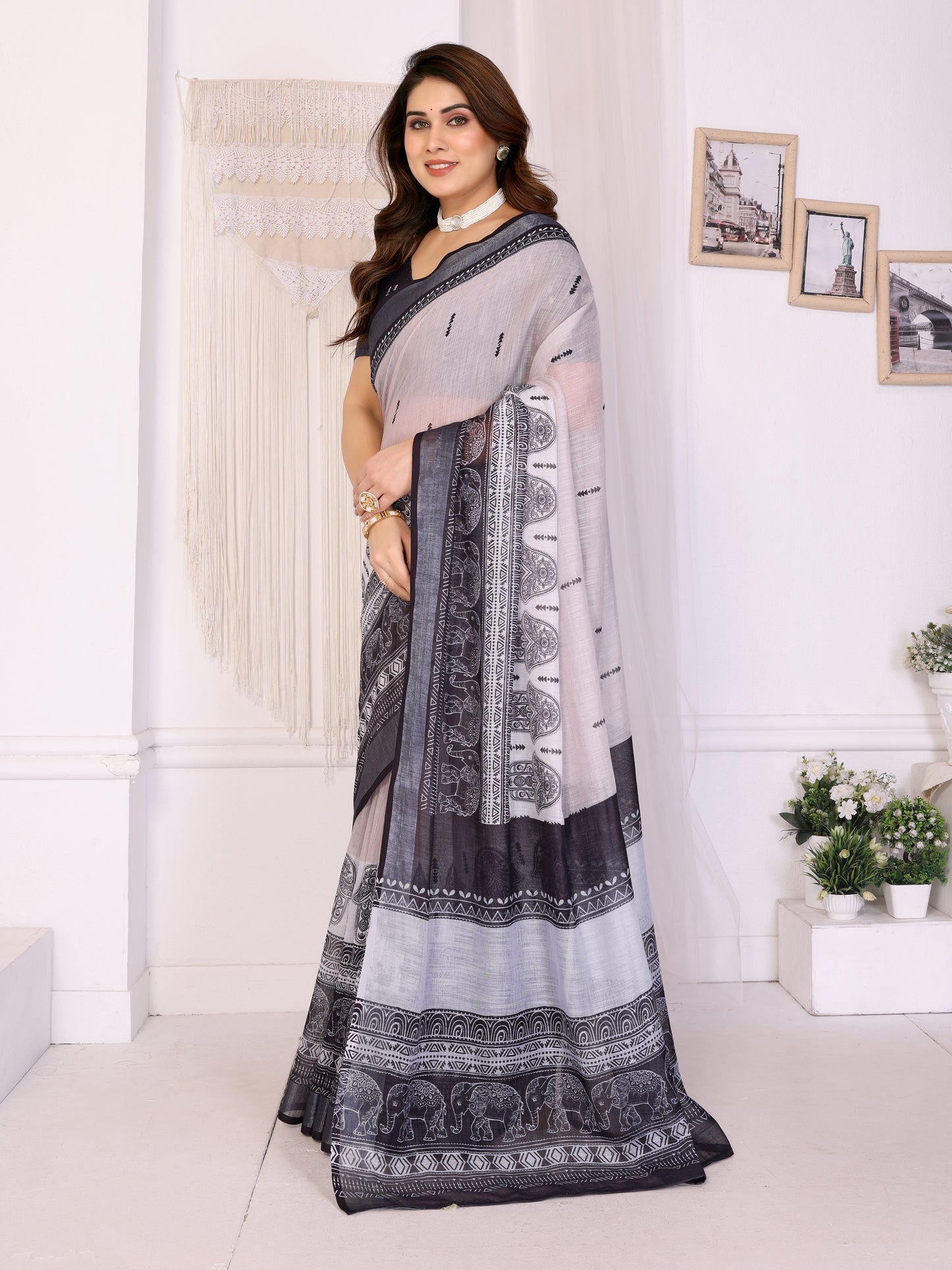 Ivory Mist Linen Cotton Saree with Classic Black Elephant Heritage Border