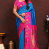 Capricious Blue Paithani Silk Saree With Glowing Blouse Piece