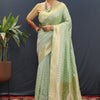 Snazzy Pista Soft Banarasi Silk Saree With Confounding Blouse Piece