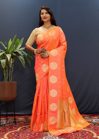 Quintessential Peach Soft Banarasi Silk Saree With Surreptitious Blouse Piece