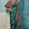 Enticing Dark Green Digital Printed Crape Silk Saree With Diaphanous Blouse Piece