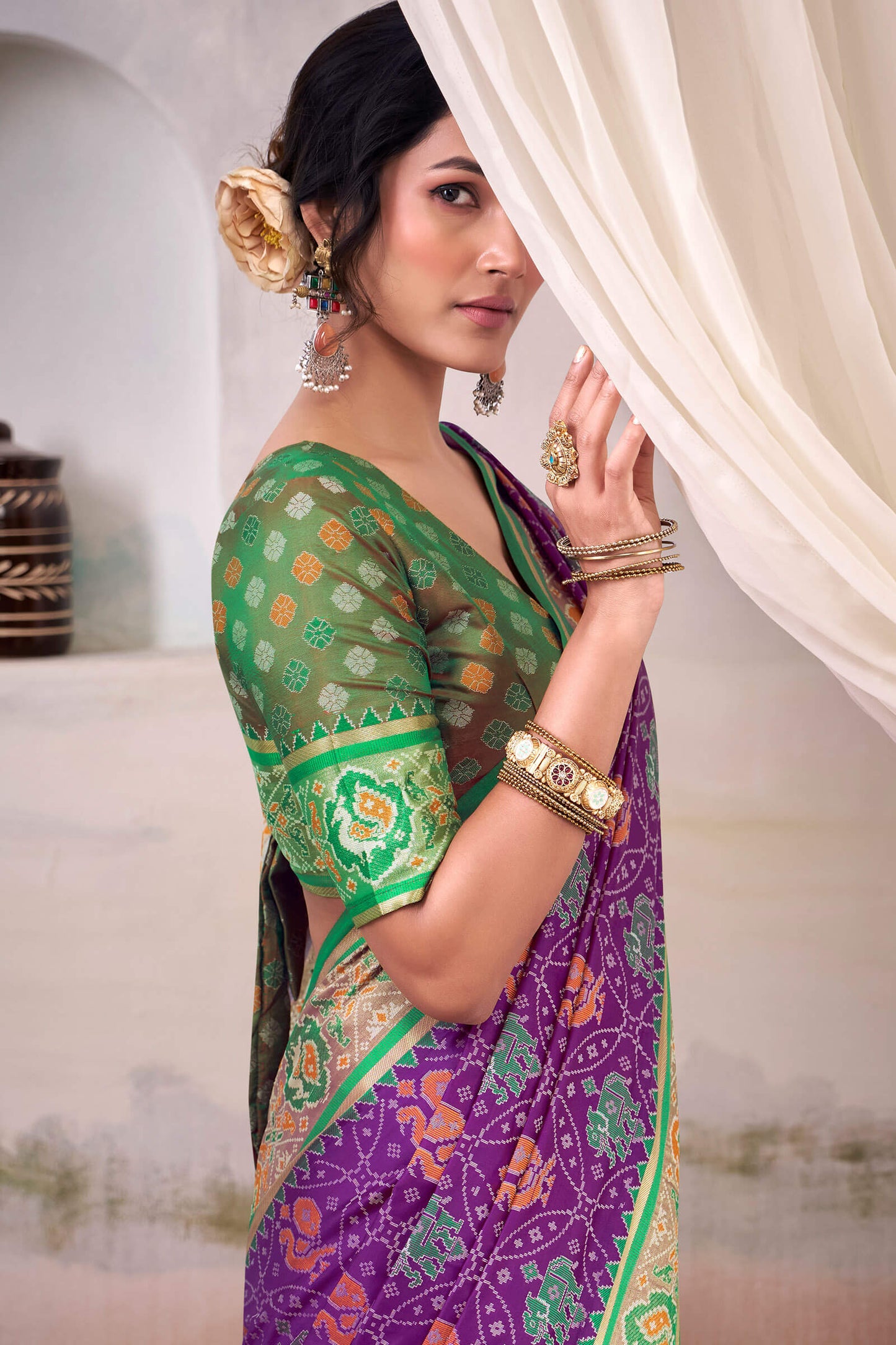 Engrossing Purple Patola Silk Saree With Fairytale Blouse Piece