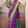 Engrossing Purple Patola Silk Saree With Fairytale Blouse Piece