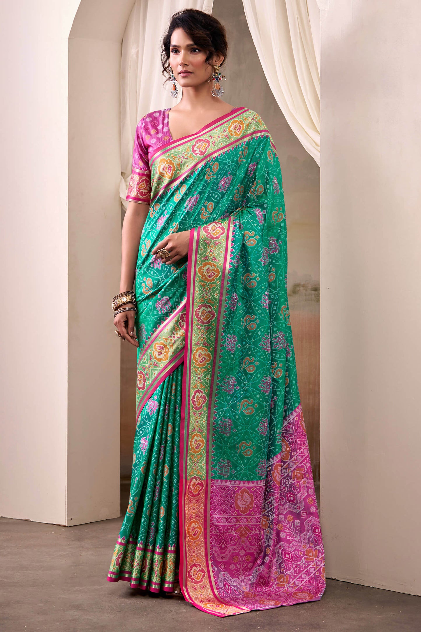 Radiant Rama Patola Silk Saree With Effulgent Blouse Piece