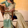 Entrancing Beige Soft Banarasi Tissue Silk Saree With Murmurous Blouse Piece