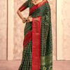 Enigmatic Dark Green Foil Printed Dola Silk Saree With Incomparable Blouse Piece