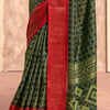 Enigmatic Dark Green Foil Printed Dola Silk Saree With Incomparable Blouse Piece