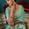 Intricate Firozi Soft Banarasi Silk Saree With Jazzy Blouse Piece