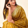 Imbrication Mustard Soft Banarasi Tissue Silk Saree With Demure Blouse Piece