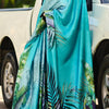 Jazzy Firozi Digital Printed Satin Silk Saree With Hypnotic Blouse Piece