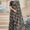 Cynosure Black Printed Mul Cotton Saree With Beleaguer Blouse Piece
