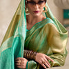 Sumptuous Green Soft Tissue Silk Saree With Gossamer Blouse Piece