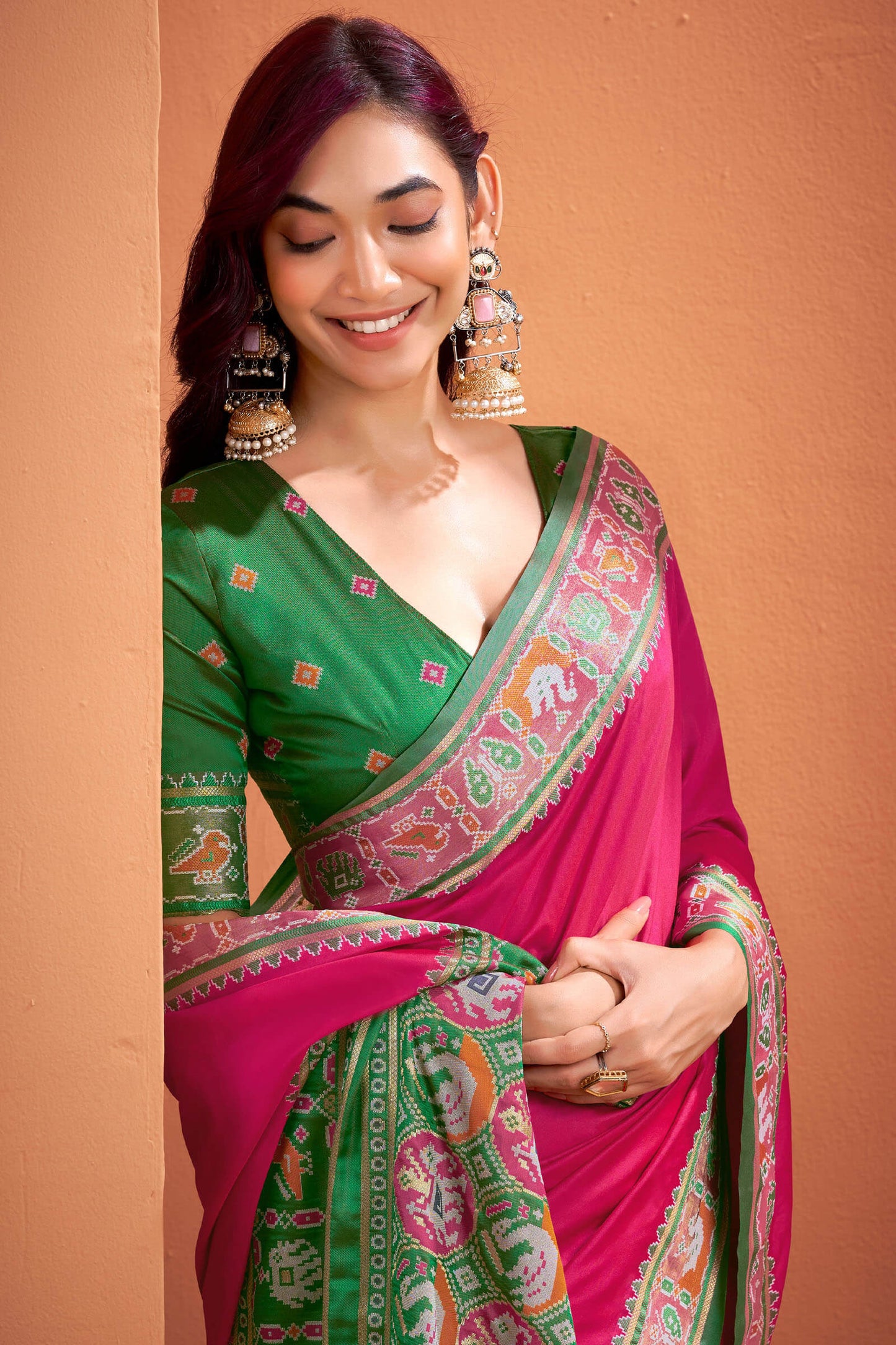 Murmurous Dark Pink Patola Silk Saree with Woebegone Blouse Piece