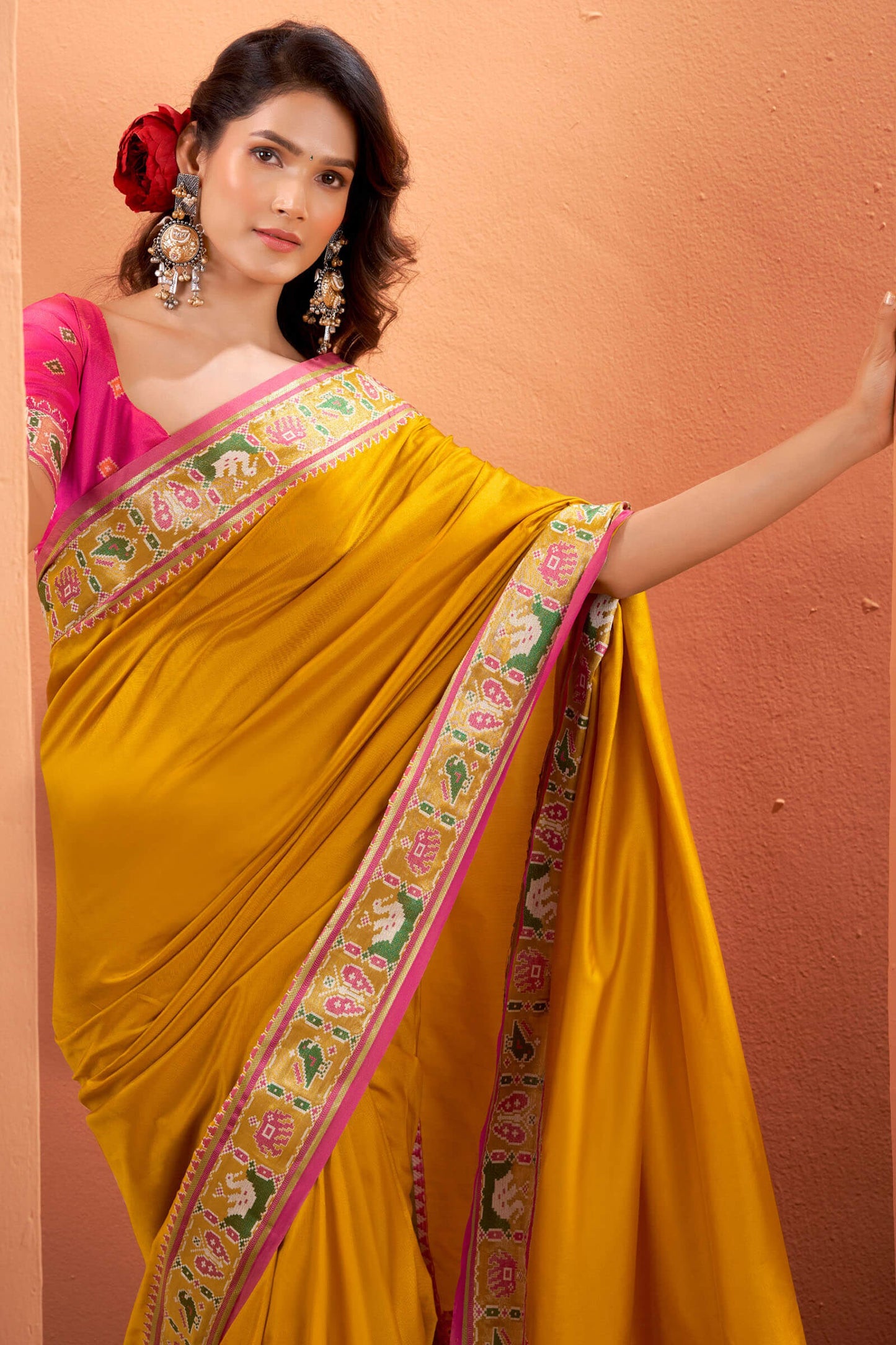 Splendiferous Yellow Patola Silk Saree with Precious Blouse Piece