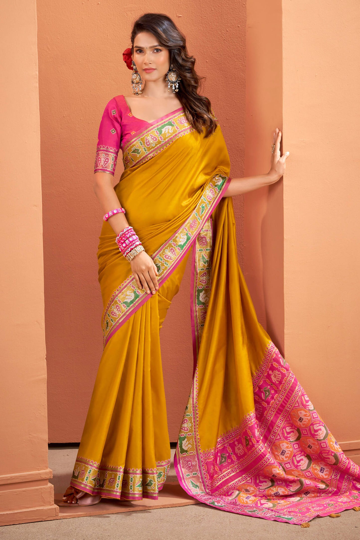 Splendiferous Yellow Patola Silk Saree with Precious Blouse Piece
