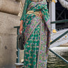 Enigmatic Dark Green Pashmina saree With Profuse Blouse Piece
