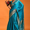 Susurrous Teal Blue Soft Banarasi Silk Saree With Embellished Blouse Piece