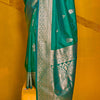 Eloquence Dark Green Soft Banarasi Silk Saree With Propinquity Blouse Piece