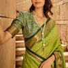 Ornate Green Patola Silk Saree with Tremendous Blouse Piece