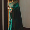 Prominent Dark Green Soft Silk Saree With Comely Blouse Piece
