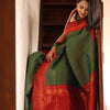 Extraordinary Dark Green Soft Silk Saree With Adorning Blouse Piece