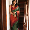Extraordinary Dark Green Soft Silk Saree With Adorning Blouse Piece