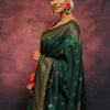 Adorning Dark Green Soft Silk Saree With Prominent Blouse Piece