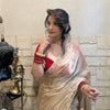 Ivory Organza Saree with Gold Floral Embroidery Border & Red Blouse Piece