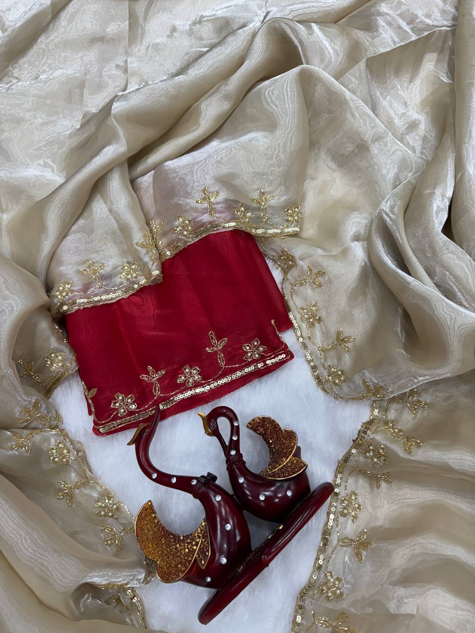 Ivory Organza Saree with Gold Floral Embroidery Border & Red Blouse Piece