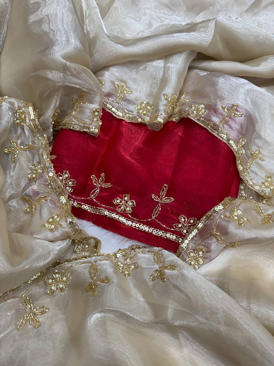 Ivory Organza Saree with Gold Floral Embroidery Border & Red Blouse Piece