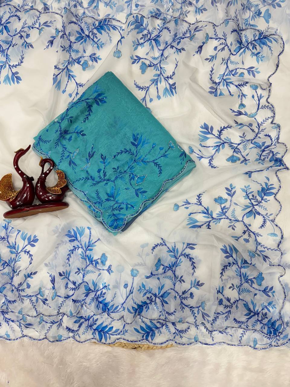 Aqua Blue Net Saree with Blue Floral Embroidery & Scalloped Border