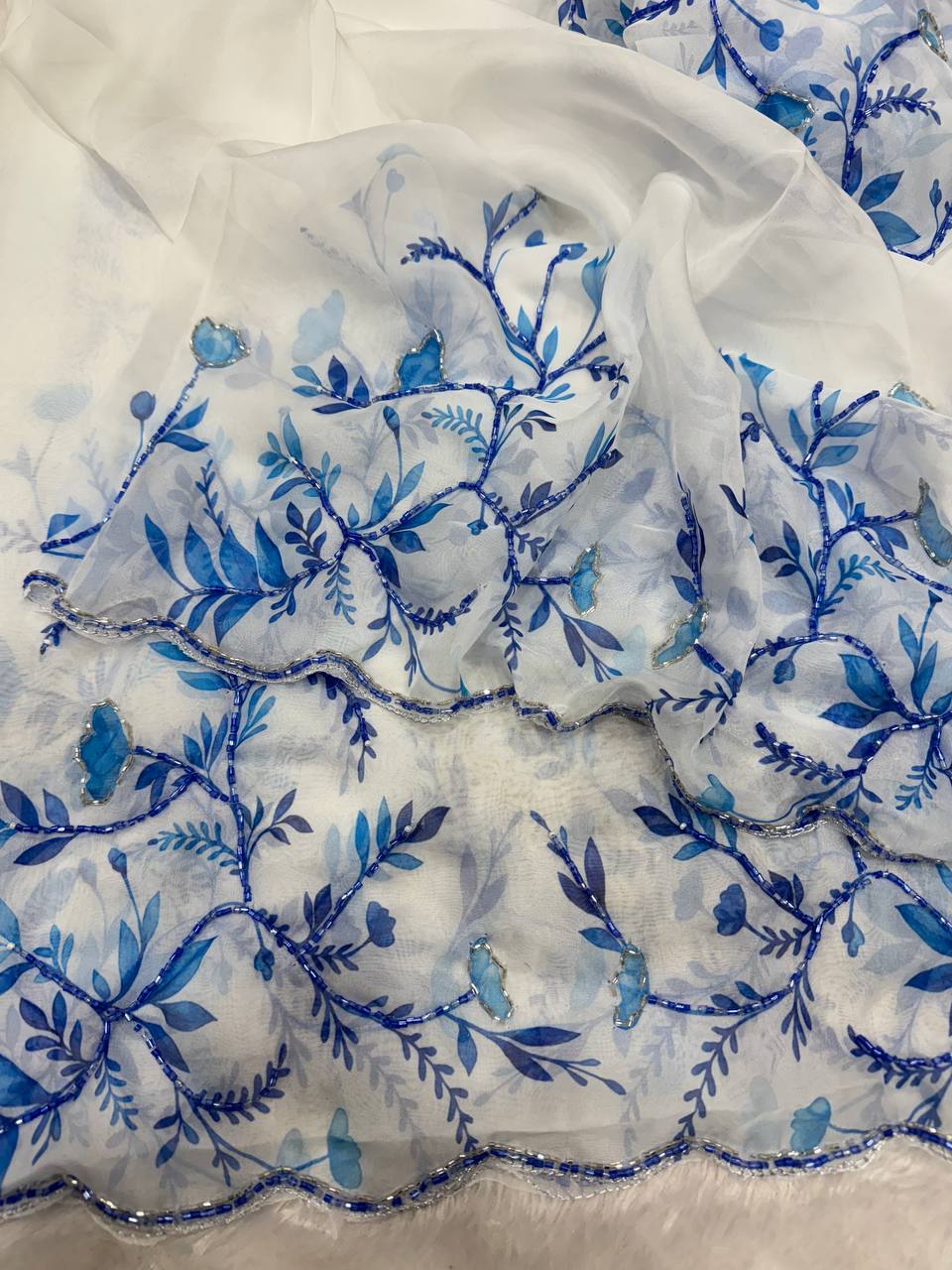 Aqua Blue Net Saree with Blue Floral Embroidery & Scalloped Border