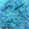 Aqua Blue Net Saree with Blue Floral Embroidery & Scalloped Border