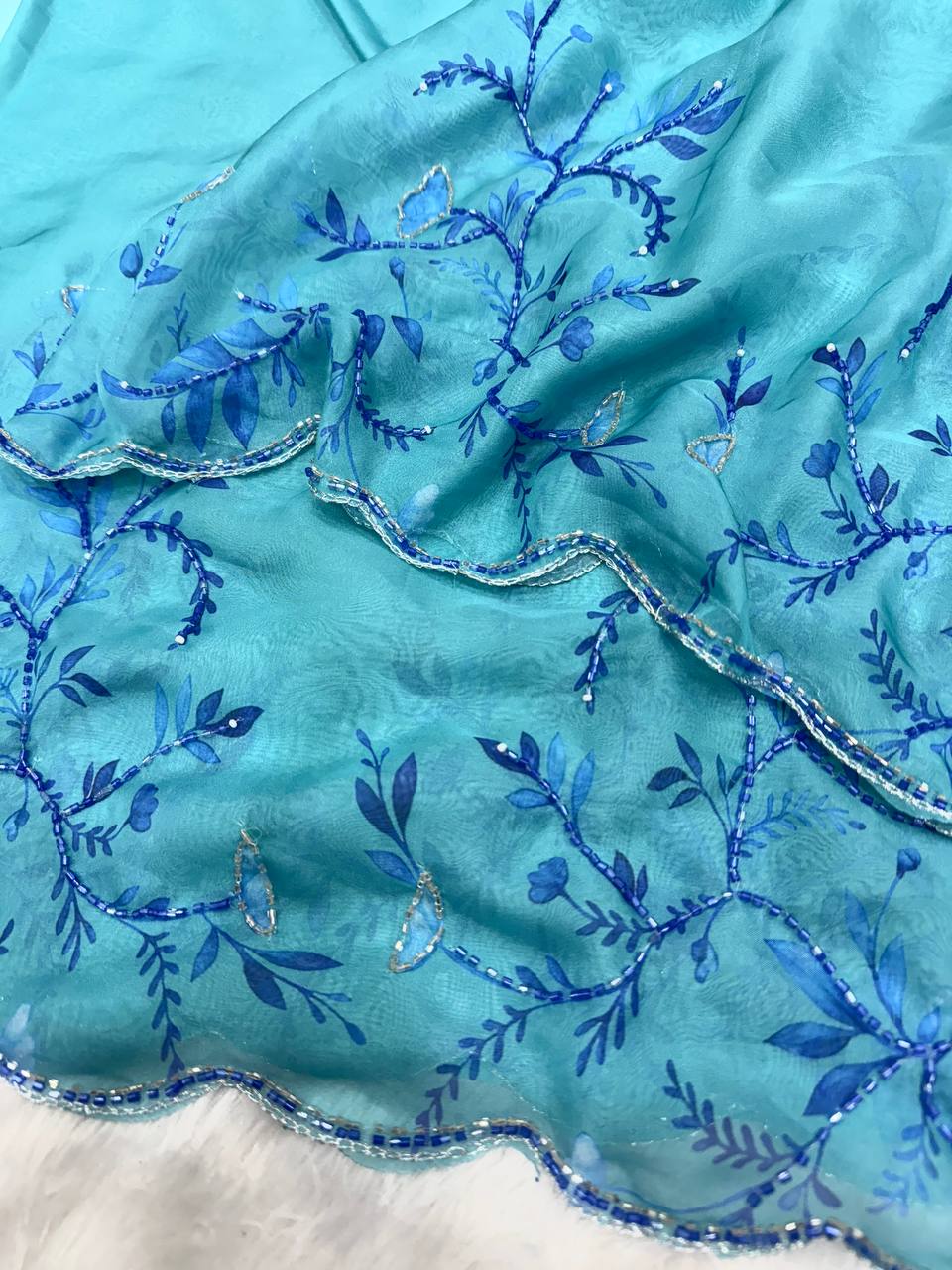 Aqua Blue Net Saree with Blue Floral Embroidery & Scalloped Border