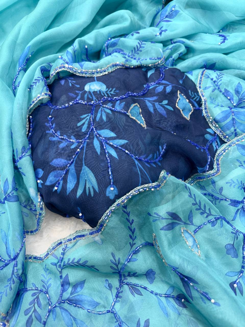 Aqua Blue Net Saree with Blue Floral Embroidery & Scalloped Border