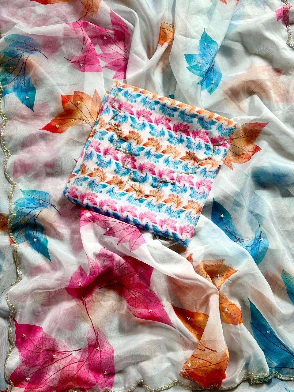 Ivory Whisper Organza Saree with Multicolor Leaf Motifs & Pearl Finish Border