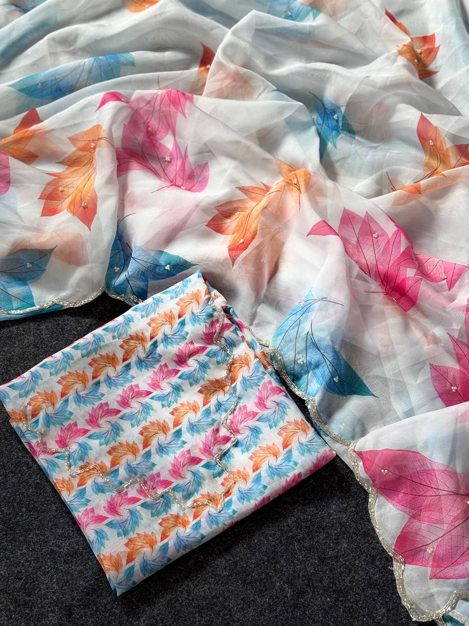 Ivory Whisper Organza Saree with Multicolor Leaf Motifs & Pearl Finish Border