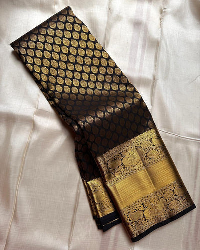Royal Black Banarasi Silk Saree with All-Over Gold Zari Butti & Grand Peacock Border | Premium Wedding & Festive Wear