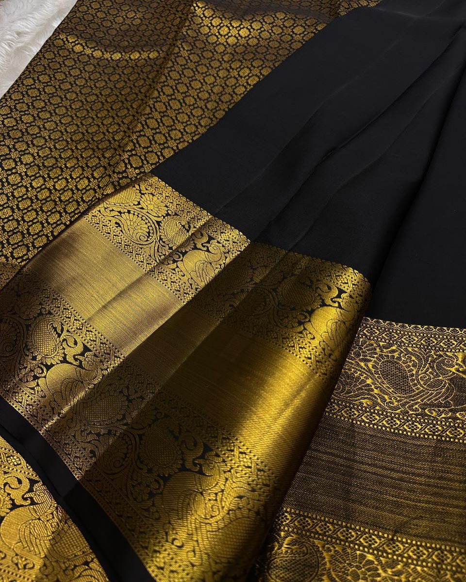 Royal Black Banarasi Silk Saree with All-Over Gold Zari Butti & Grand Peacock Border | Premium Wedding & Festive Wear