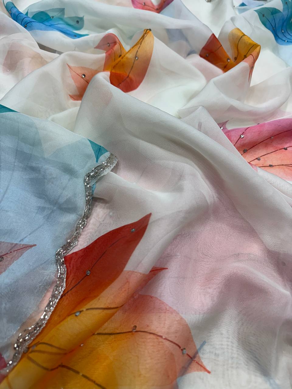 Premium White Soft Georgette Saree With Multicolor Leaf Print & Stone Work Fancy Saree
