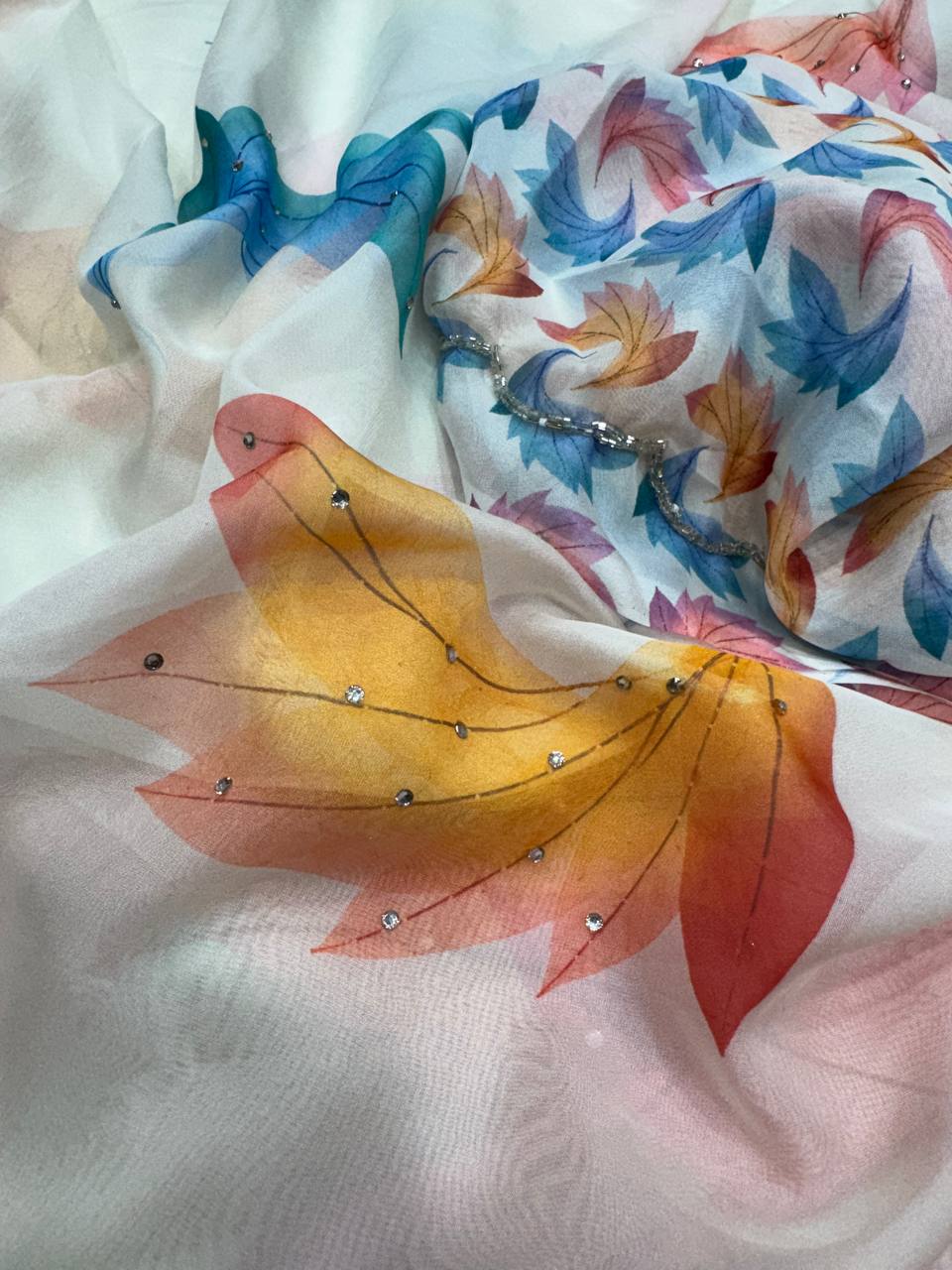 Premium White Soft Georgette Saree With Multicolor Leaf Print & Stone Work Fancy Saree