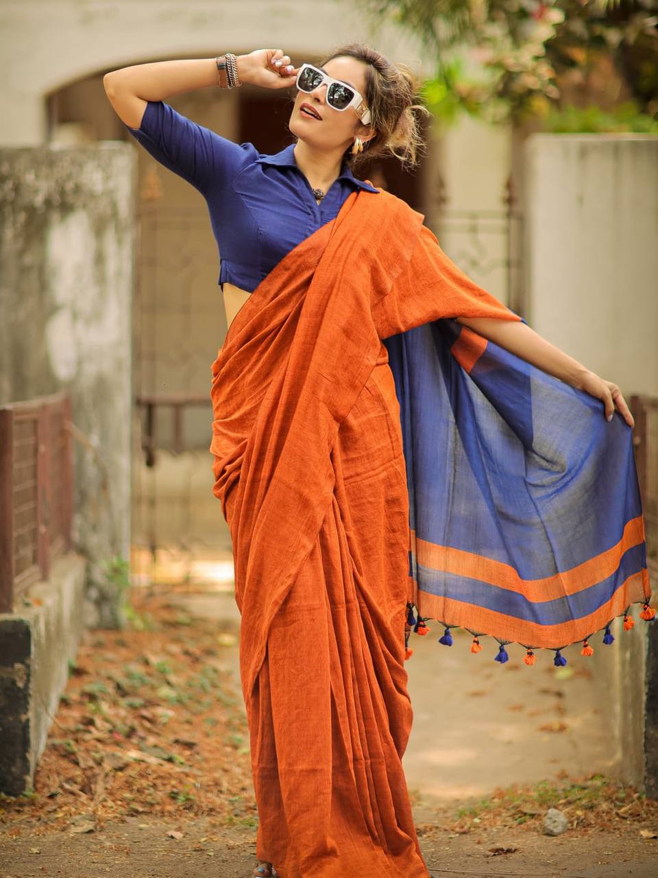 Rust Orange Linen Saree with Navy Blue Contrast Pallu & Tassels | Modern Minimal Everyday Wear