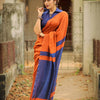Rust Orange Linen Saree with Navy Blue Contrast Pallu & Tassels | Modern Minimal Everyday Wear