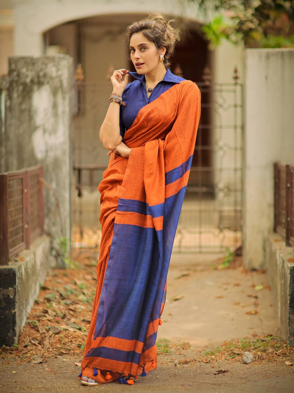 Rust Orange Linen Saree with Navy Blue Contrast Pallu & Tassels | Modern Minimal Everyday Wear